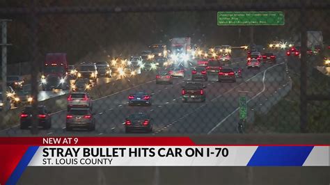 Stray bullet from I-70 gun battle hits car